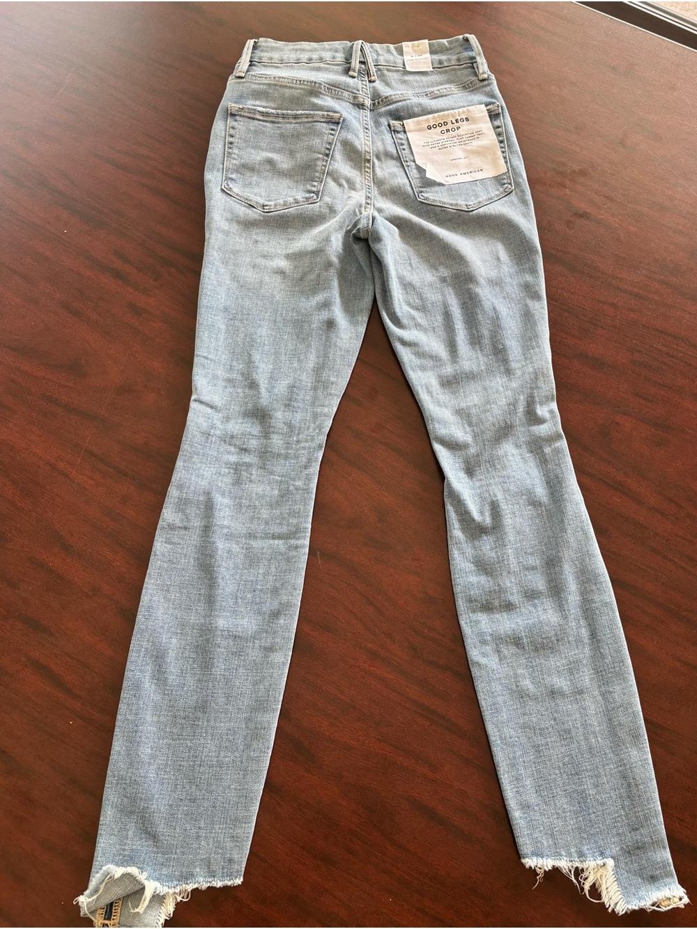 Good American Light Blue Skinny Jeans with Distressed Knee
